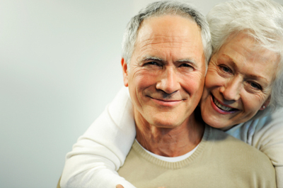 An older couple embracing each other for pain management.
